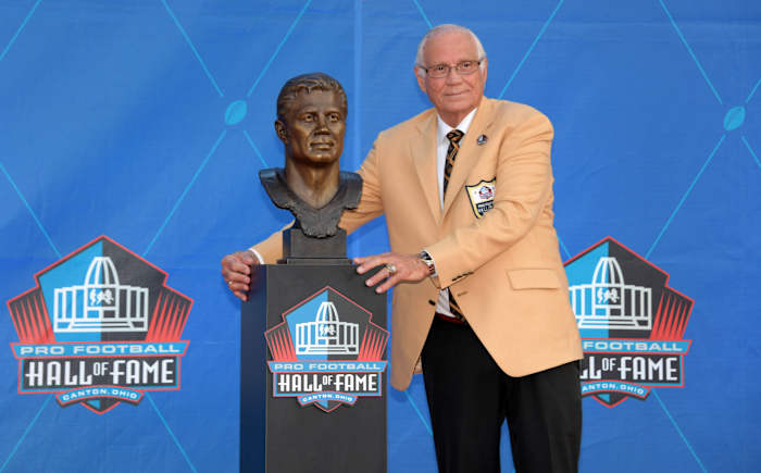 Aug 3, 2019; Canton, OH, USA; Johnny Robinson poses with bust during the Pro Football Hall of Fame Enshrinement at Tom Benson Hall of Fame Stadium.
